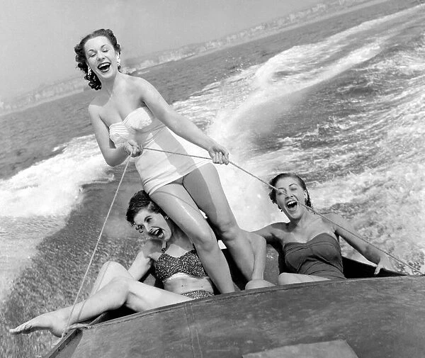 Out on the ocean waves, August 1954 3 girls go for a spin on a speedboat in