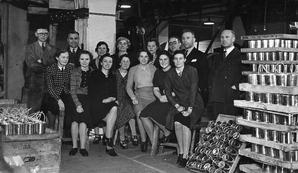 Some of the office staff of a local Tin Box factory, making collecting boxes for the red
