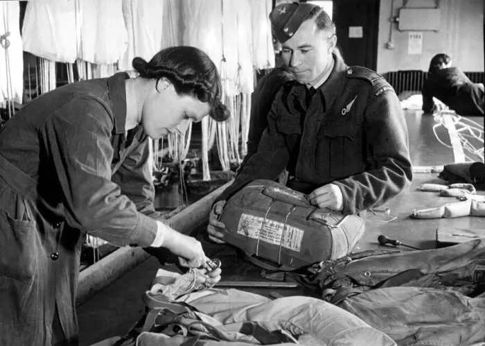 Framed Print : An Officer Observer fetches his Mae West and parachute for checking by a WaFS officer Framed Print : An Officer Observer fetches his Mae West and parachute for checking by a WaFS officer