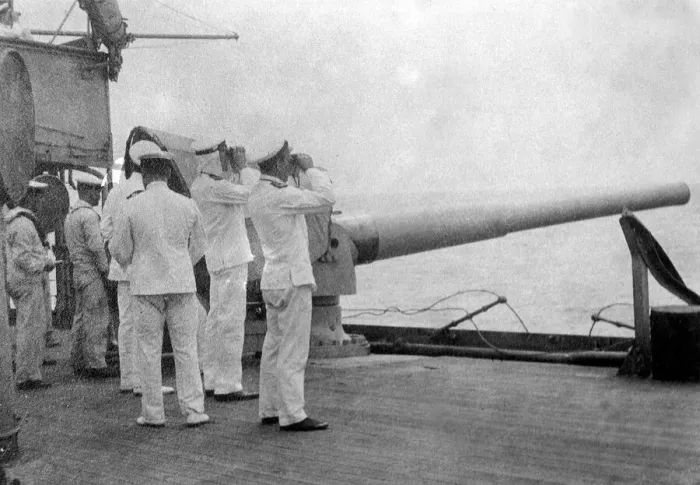 Framed Print : Officers on board a a British Royal Navy warship watching the effect of its gunfire Framed Print : Officers on board a a British Royal Navy warship watching the effect of its gunfire