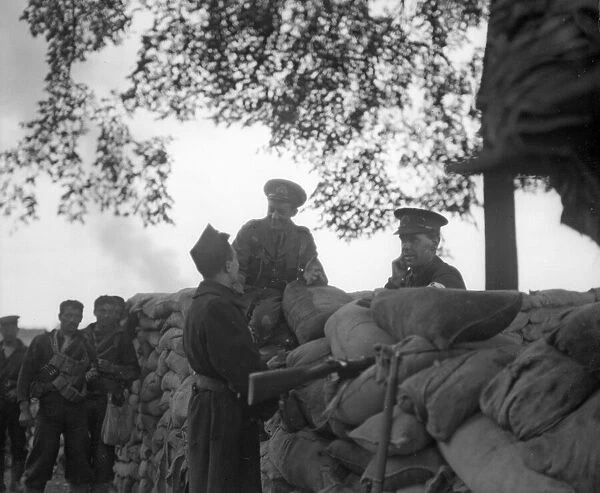 Officers with the British Naval Brigade seen here talking with a Belgian at the defences