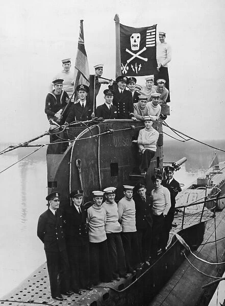 Some of the officers and crew of HMS Unison seen here on deck with their jolly roger flag
