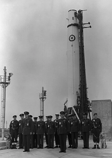 The officers and men who form the launch crew standing in front of a Thor