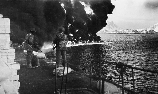 Oil burning on the surface of the sea following the British raid on the Norwegian Lofoten