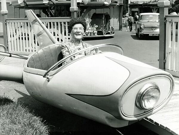 Old age pensioner Ellen Pert 101 years old rides in a fairground dive-bomber car ride