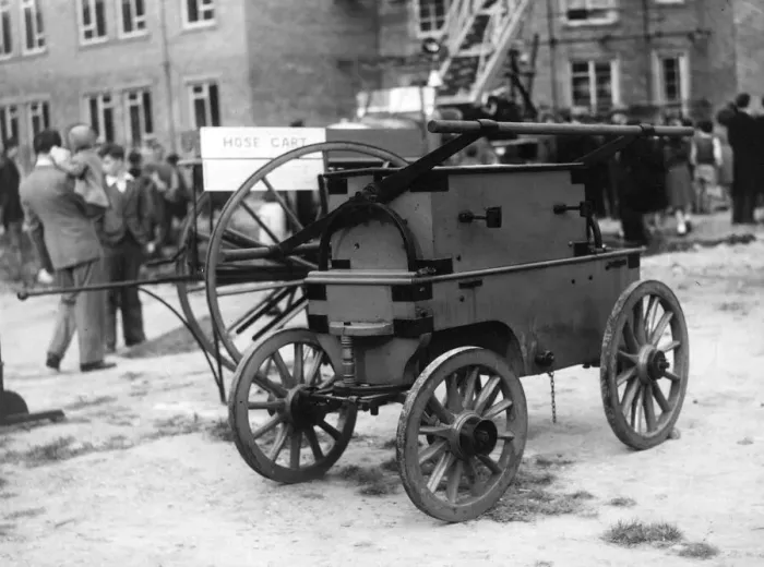 Framed Print : An old firefighters manual water pump in a fire applances demonstation by Durham Fire