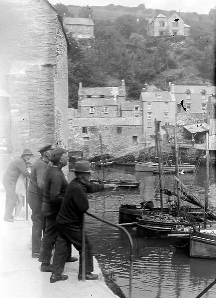 Old fishermen gathered at Polperro harbour in Cornwall August 1929 Alf 150