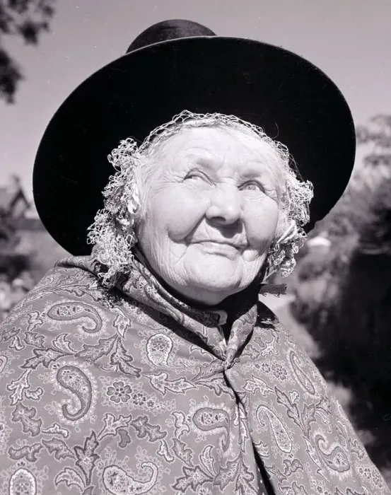 Framed Print : Old lady dressed in traditional clothes Paisley patterned shawl hat tied under chin