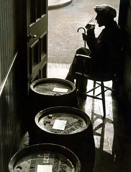 An old man enjoying a drink in his local tavern at Dartmouth Devon November 1939