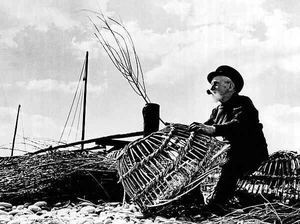 An old man of the Sea This ancient tar mends lobster pots at Budleigh Salterton in