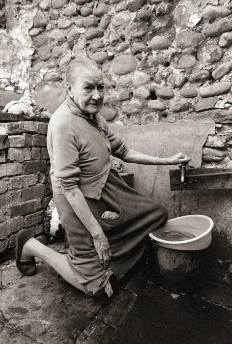 Framed Print : Old Mary Wallace washes her dishes outside in hubert Street in Newtown cardiff Framed Print : Old Mary Wallace washes her dishes outside in hubert Street in Newtown cardiff