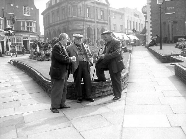 Three old men putting the world to right in the town centre of Stourbridge. 1958