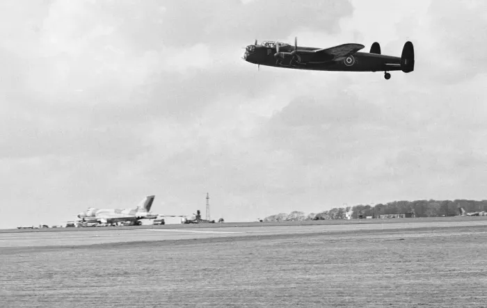 Framed Print : Old and new, a Avro Lancaster over flies a Avro Vulcan V bomber whilst taking part in