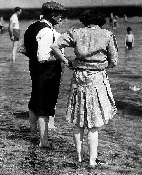 Old People on beach, bank, river bank family holiday. Unknown date