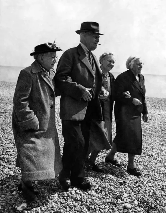 Framed Print : Old people go for walk on the pebbled ground at a Holiday Hotel in Boxhill