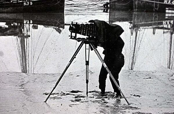 OLD PHOTOGRAPH OF A PHOTOGRAPHER ON THE BEACH MARCH 2001 USING A PLATE CAMERA ON