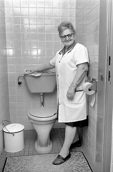 An old woman cleaning the toilet. November 1969 Z10818