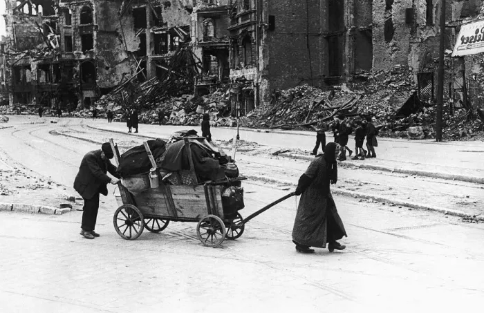 Framed Print : An old woman and her husband July 1945 trundle through the Leipzig Strasse of