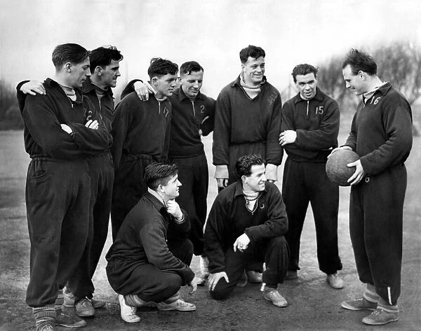 Oldam Athletic player manager George Hardwick (right) speaks to players during a training