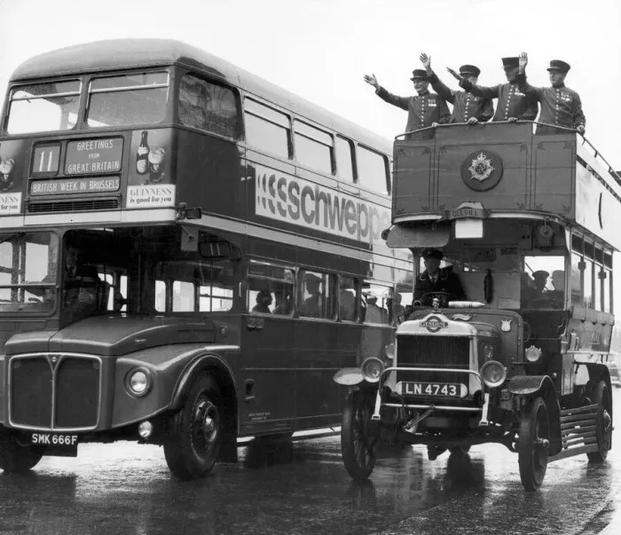 Framed Print : Ole Bill, a London bus from around 1914, is overtaken by one of the modern day Framed Print : Ole Bill, a London bus from around 1914, is overtaken by one of the modern day