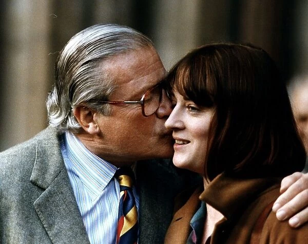 Oliver Reed Actor kissing wife Josephine on check
