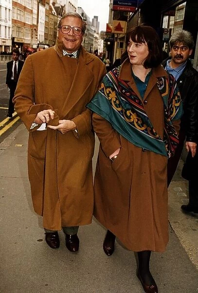 Oliver Reed Actor walking down street with wife Josephine to apear at the High Court