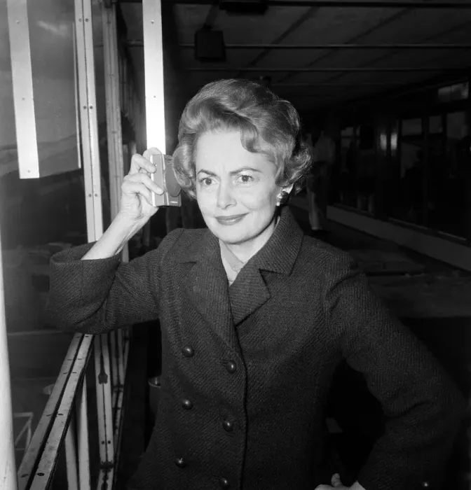 Framed Print : Olivia De Havilland listens to the budget at London Airport while waiting for a flight Framed Print : Olivia De Havilland listens to the budget at London Airport while waiting for a flight
