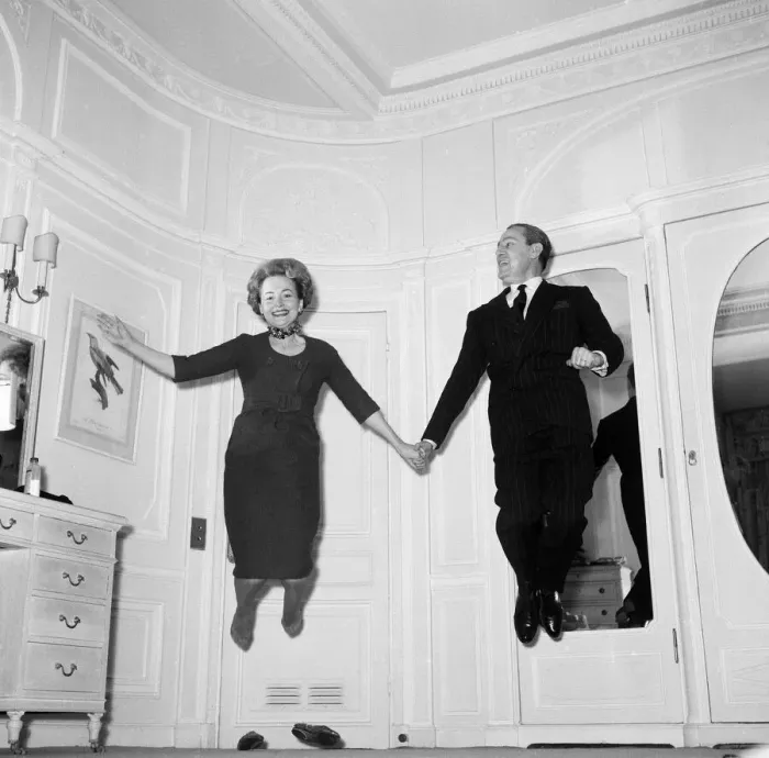 Framed Print : Olivia De Havilland playing a jumping game with her husband Pierre Galante Framed Print : Olivia De Havilland playing a jumping game with her husband Pierre Galante