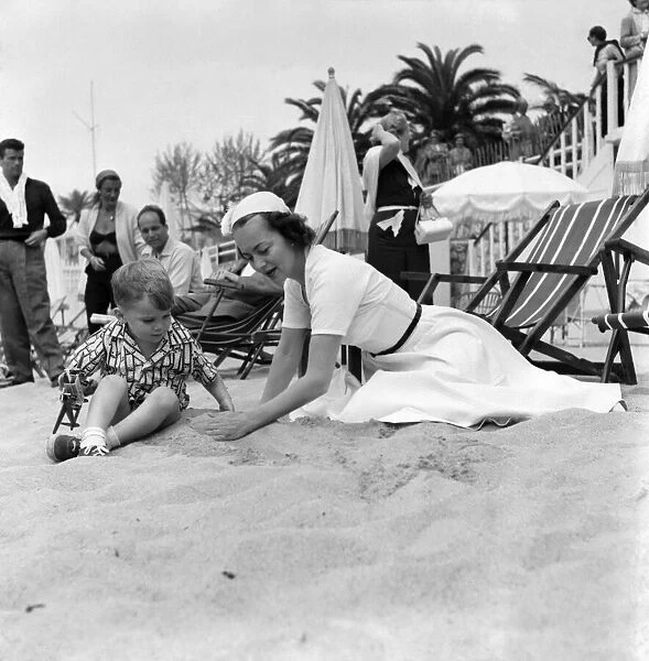 Olivia De Havilland seen here on the beach at Cannes. April 1953 D2154A