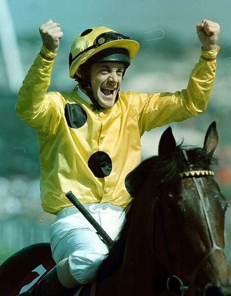 Olivier Peslier Jockey celebrates after winning the Derby on High Rise Racehorse as he is