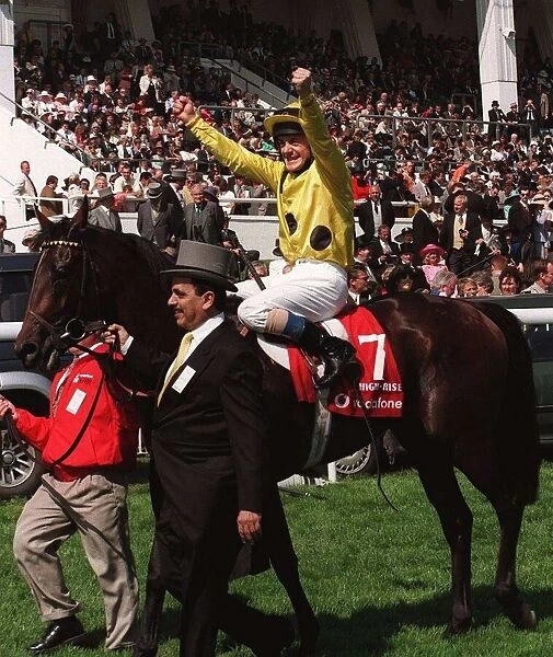 Olivier Peslier Jockey celebrates after winning the race on High Rise Racehorse as he is