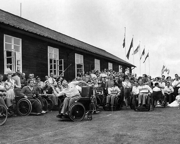 'Olympic games'In wheel chairs. Flags of twelve nations fluttered from masts