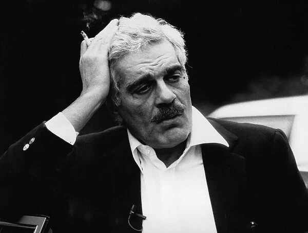 Omar Sharif takes a break from filming at Highclere Castle near Newbury for a documentary