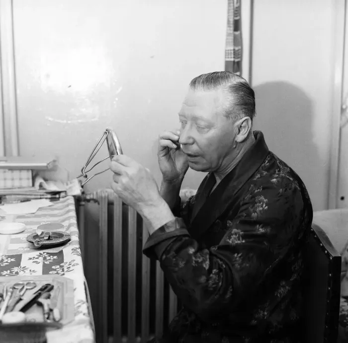 Framed Print : The show must go on, says George Formby, appearing as Mr Wu in Aladdin