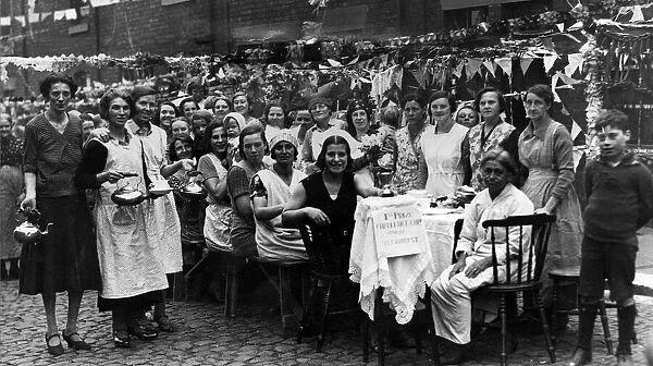 An open-air tea party in Salisbury Street, Newcastle, celebrating the best dressed street