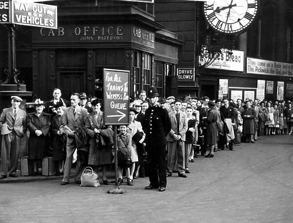 Orderly queue of passengers for train to Wemyss Bay, Glasgow Central Station, Glasgow