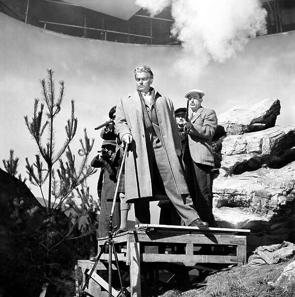 Orson Welles (centre) seen here filming on the set of 'Trouble in the Glen'