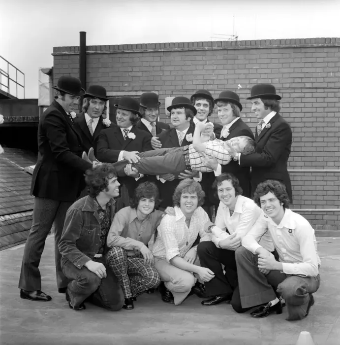 Framed Print : The Osmond Brothers pop group pose with body guards dressed as city gents with bowler Framed Print : The Osmond Brothers pop group pose with body guards dressed as city gents with bowler