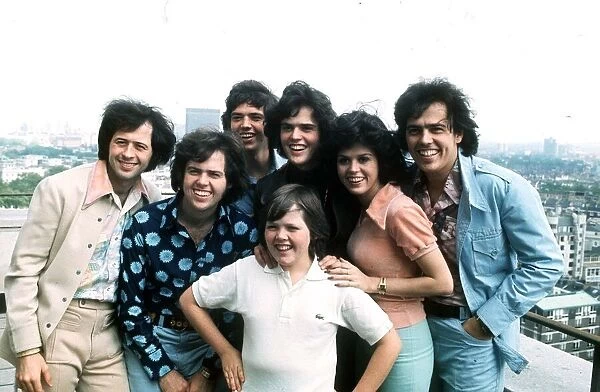 The Osmonds pop group on roof Circ 1975