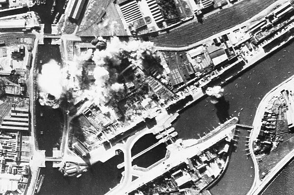 Ostend was attacked by R. A. F. bombers on 3. 10. 41 and bombs are seen bursting o oil