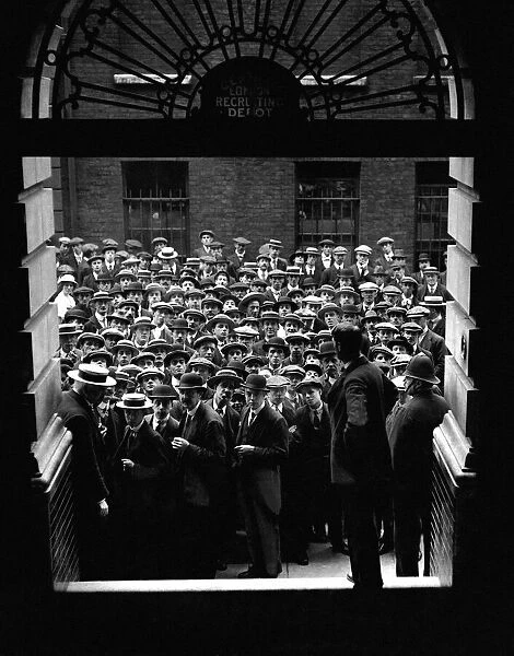The outbreak of World War One. Men queue to join the army at Scotland Yard