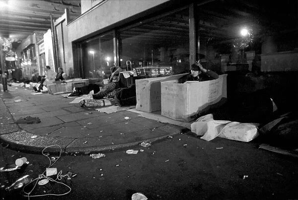 Down and outs sleep rough under the arch of the back entrance of Charing Cross Station