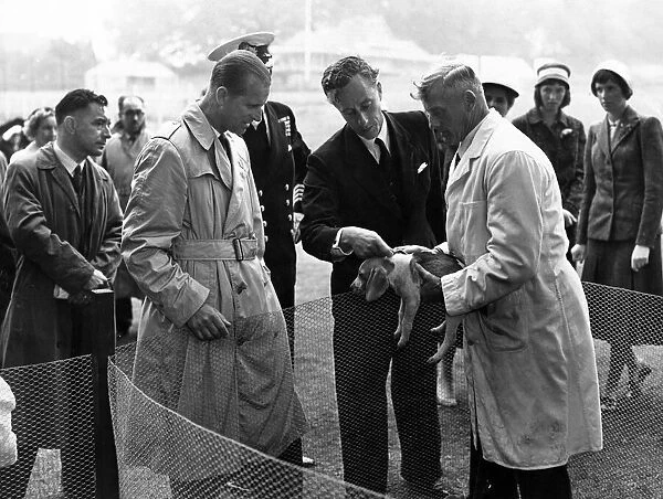 Outside, the Duke of Edinburgh owned a raincoat and visited the Beagles kennels at