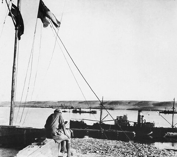 Outside Navy House, Tobruk. Note sunken ship in background. Circa 1940s
