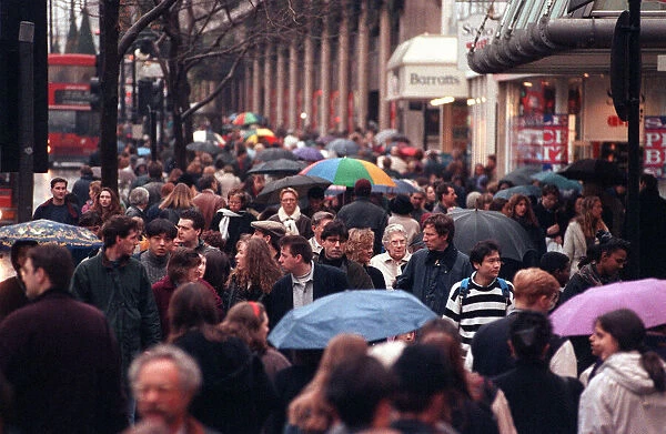 Oxford Street sales - crowds window shopping. Jan uary 1994