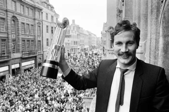 Framed Print : Oxford United footballer holds aloft the Second Division Championship trophy on an open Framed Print : Oxford United footballer holds aloft the Second Division Championship trophy on an open