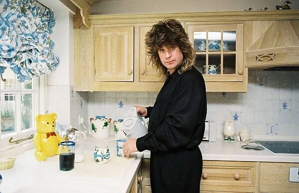 Ozzy Osbourne at home making a cup of tea. May 1988