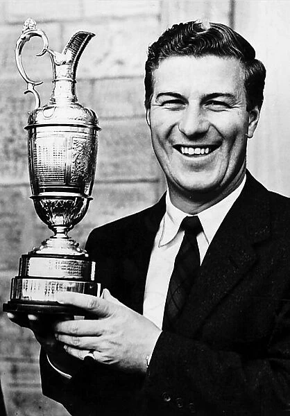 P W Thomson golfer holding trophy open golf champion claret bowl