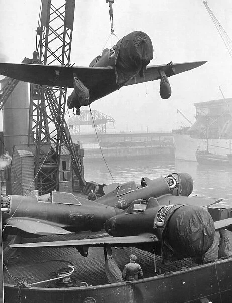 P47 Thunderbolt Aircraft are unloaded from a ship in a northern UK port