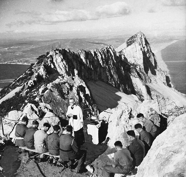 A Padre holding Communion in the mountains for soldiers. 24th March 1943